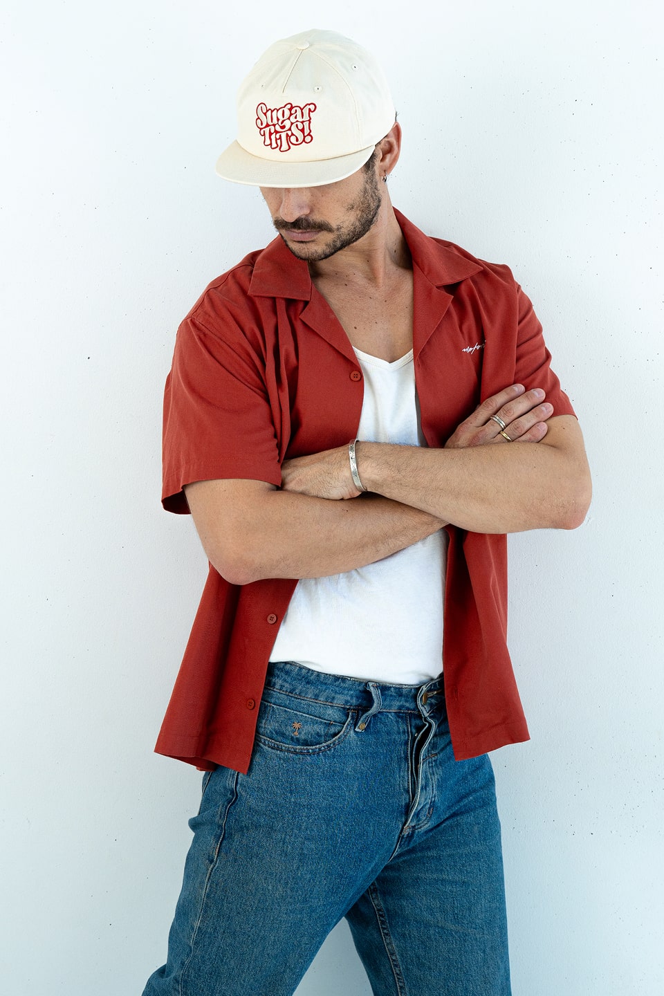 Bobby Lovejoy Cream cap worn by male model, posing