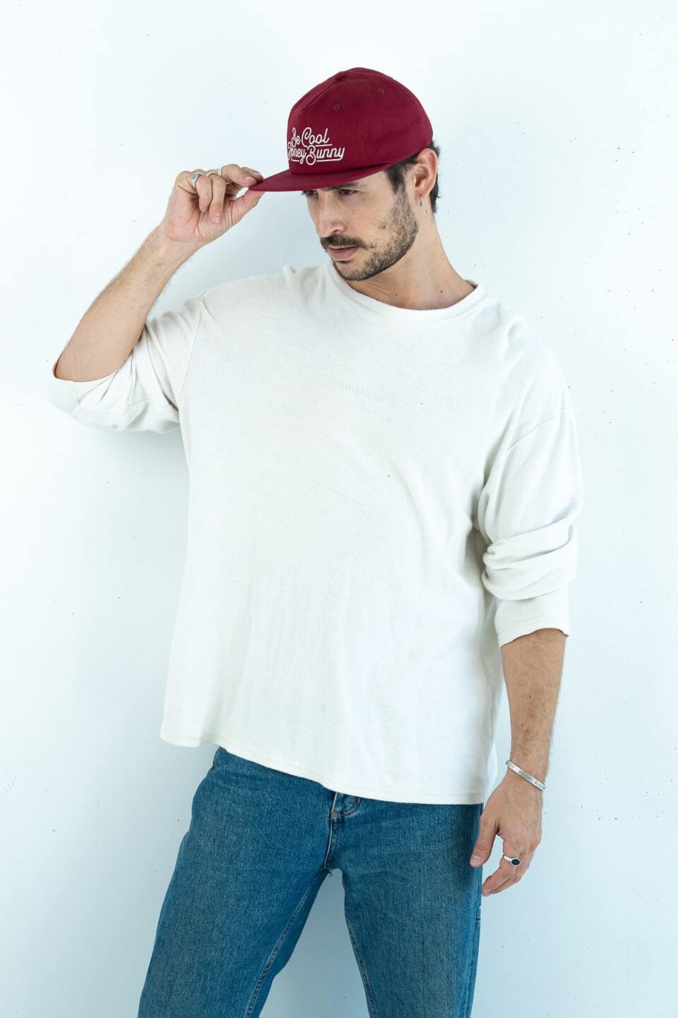 Bobby Lovejoy Burgundy cap worn by male model, posing