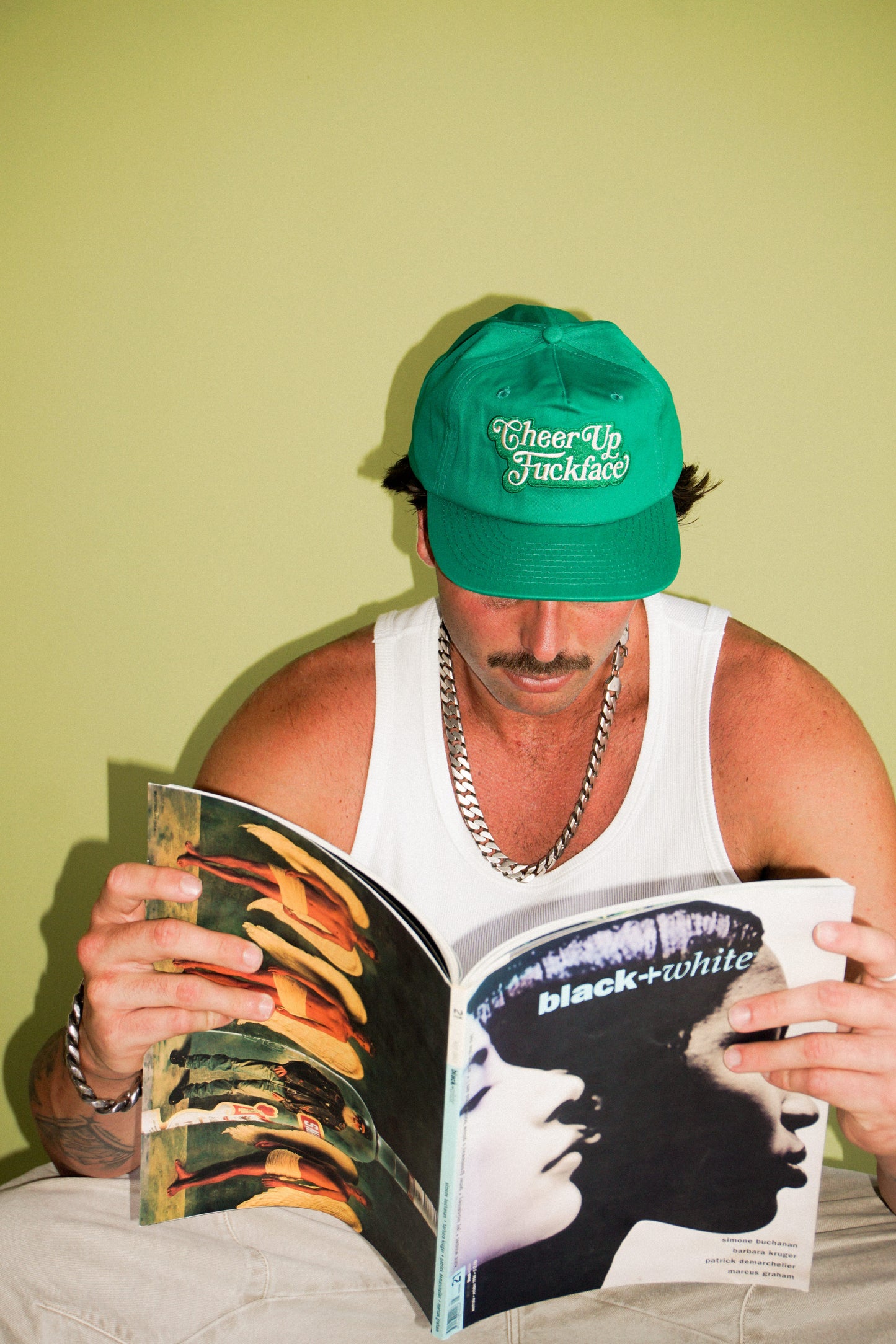 Bobby Lovejoy Green cap worn by male model, front 
